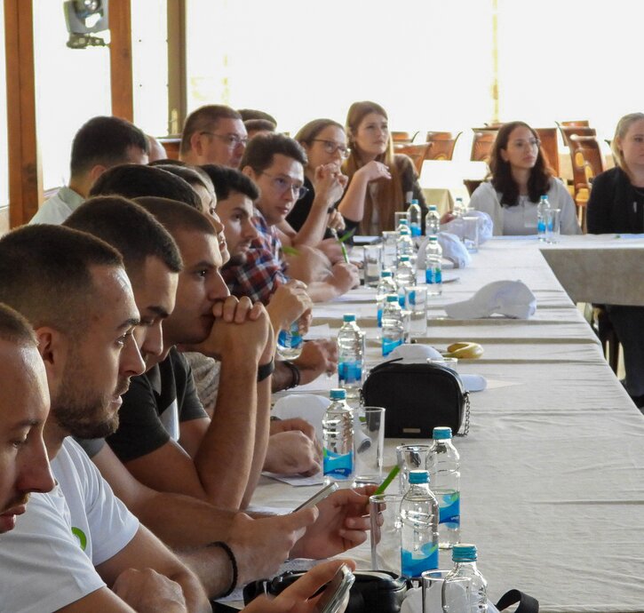 the asioso team sits at the table during the workshop